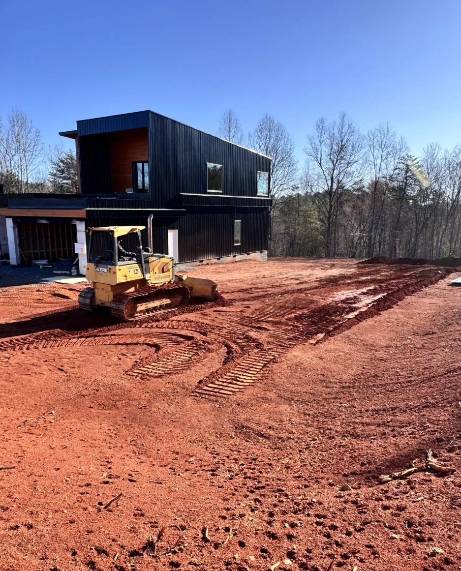 Site grading and earthwork around a newly built modern home
